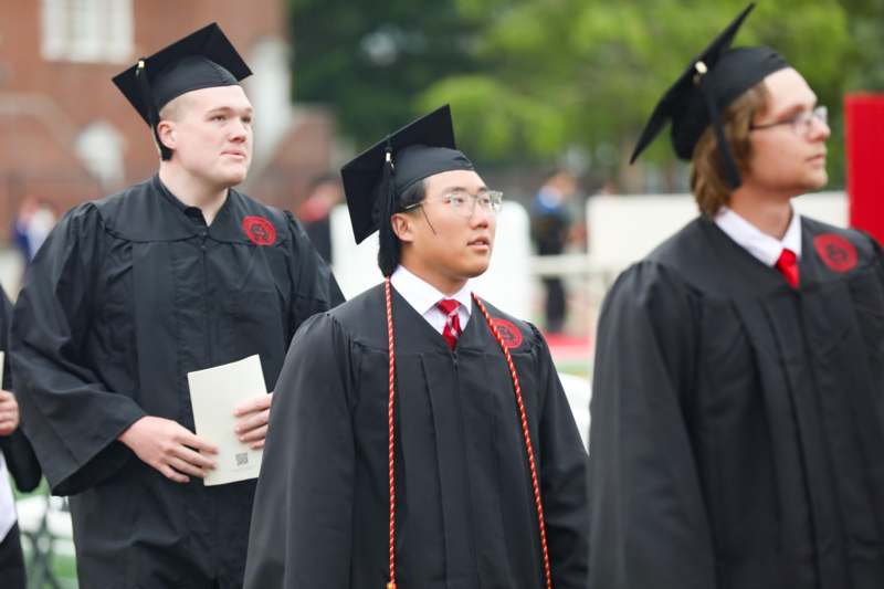 a group of people in graduation gowns