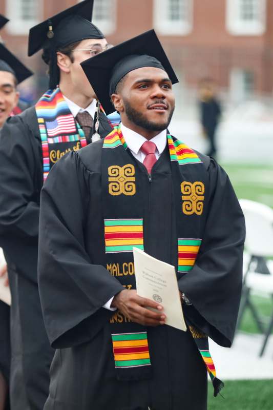 a man in a graduation gown
