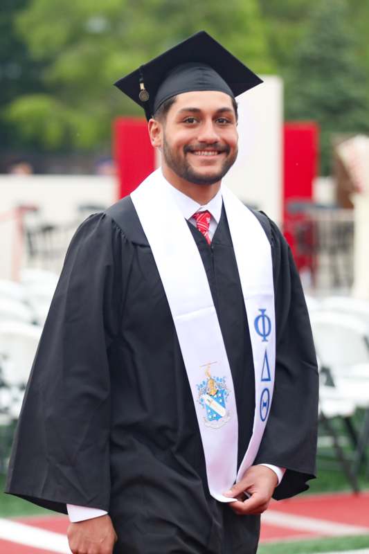 a man in a graduation gown