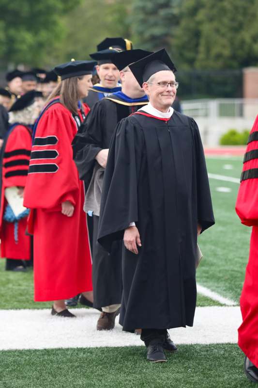 a man in a graduation gown
