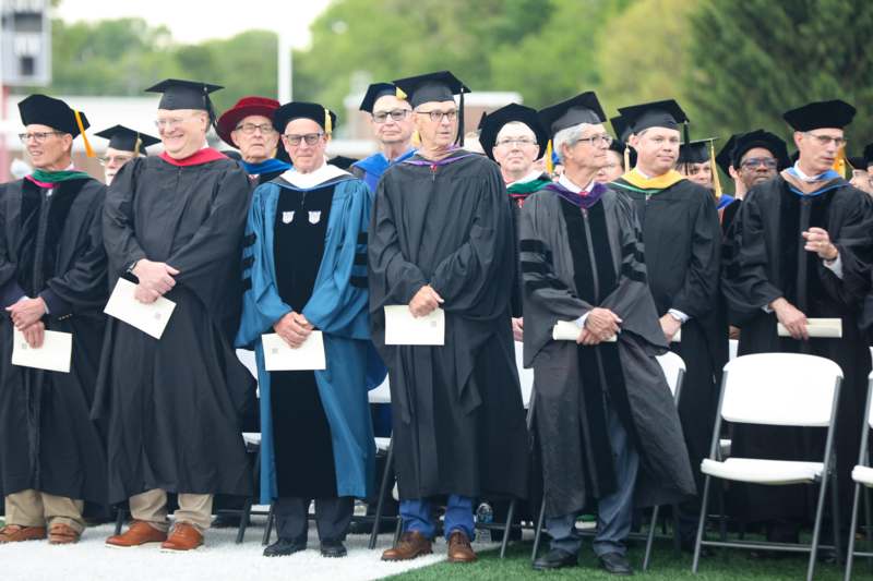 a group of people in graduation gowns