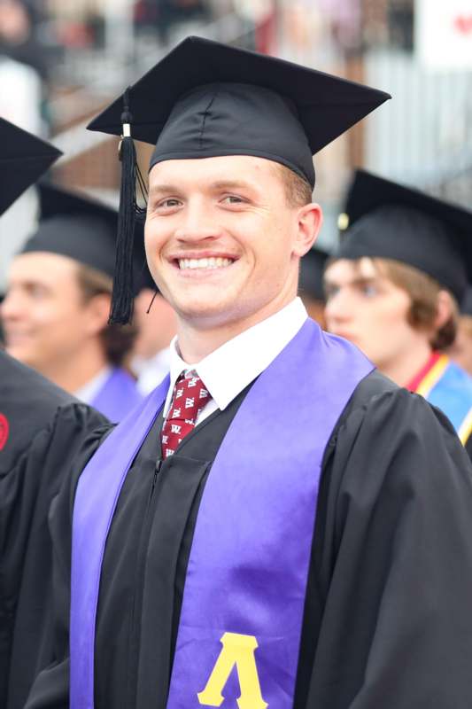 a man in a graduation gown