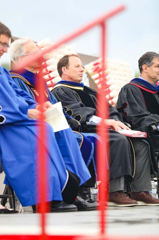 a group of men in robes sitting in chairs