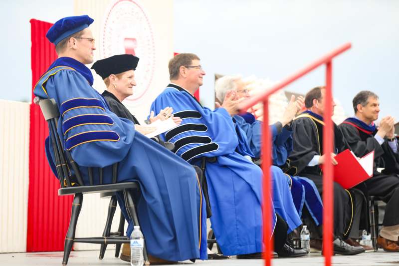 a group of people in blue robes