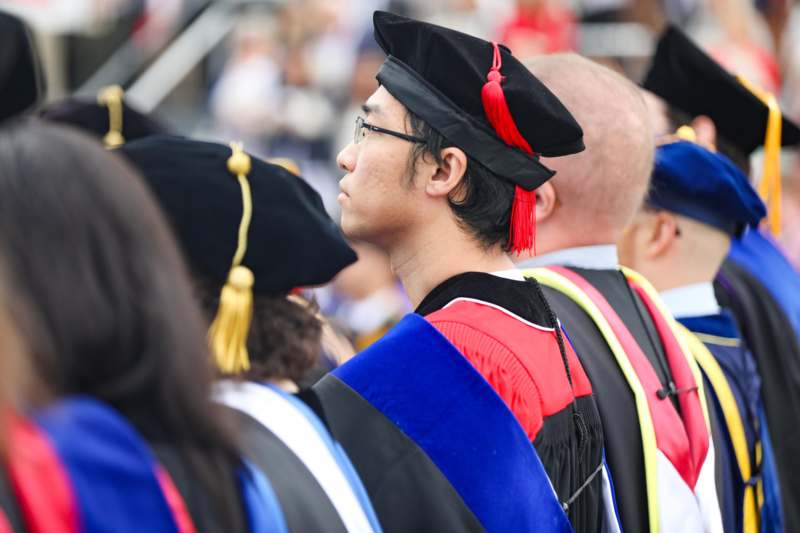 a man in a graduation gown