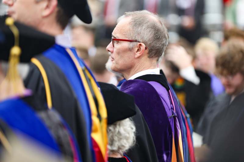a man in a graduation gown