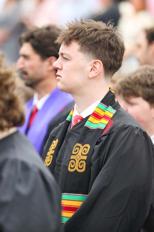 a man in a graduation gown