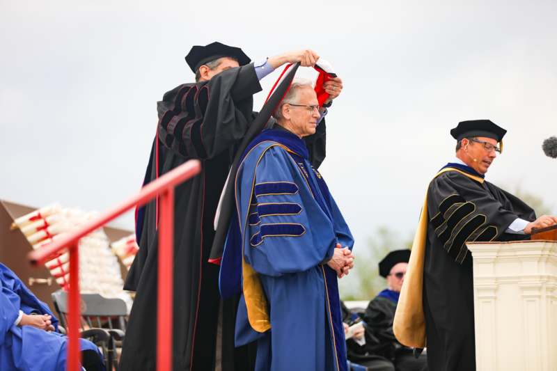 a group of people wearing graduation gowns