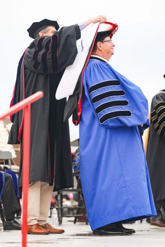 a group of people wearing graduation gowns