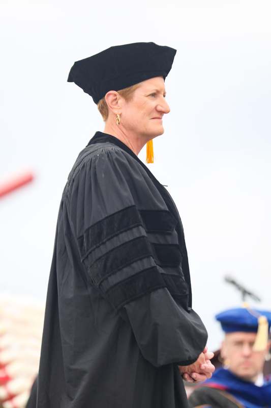 a woman in a graduation gown