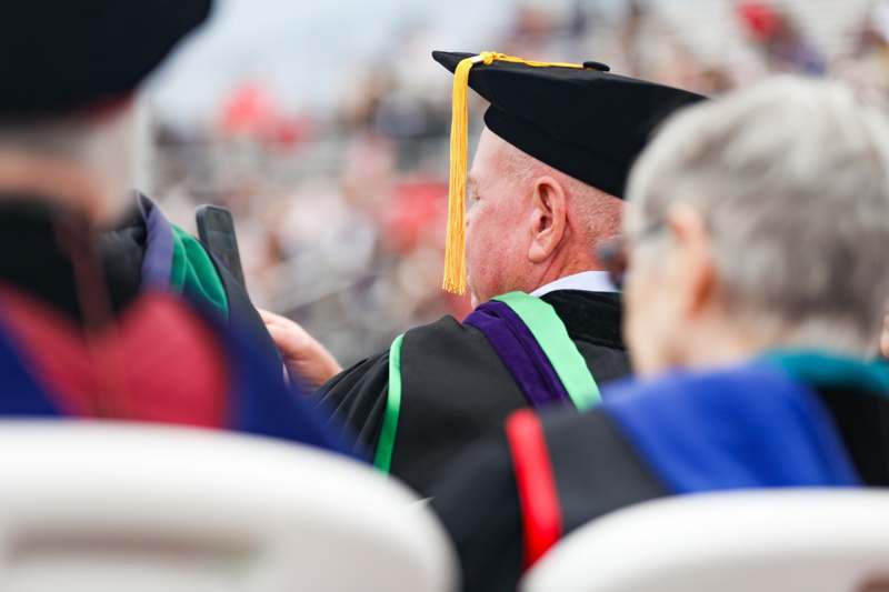 a man in a graduation gown