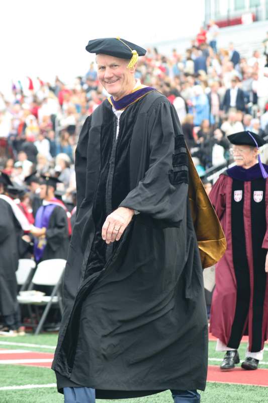 a man in a graduation gown