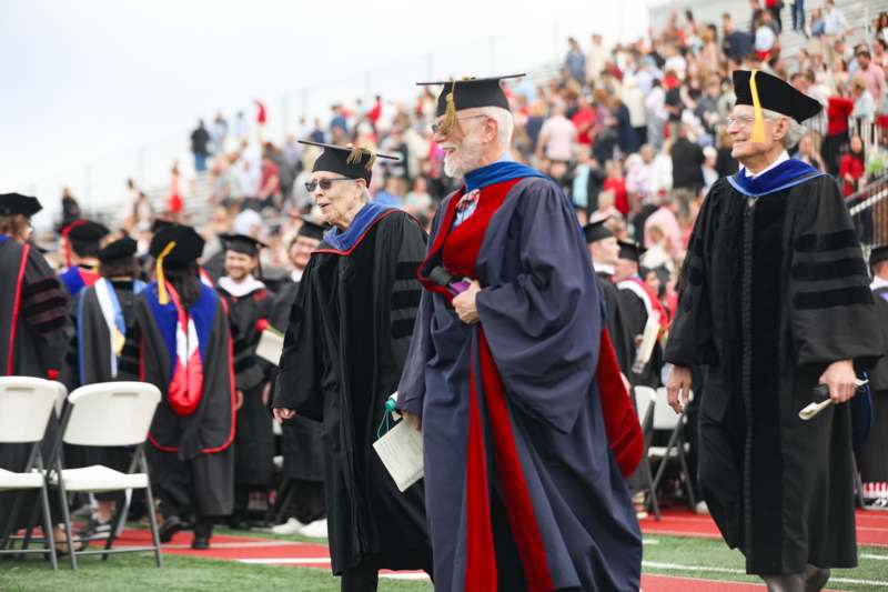 a group of people in graduation gowns