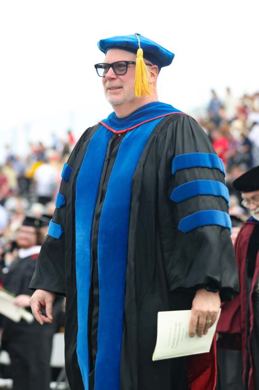 a man in a graduation gown