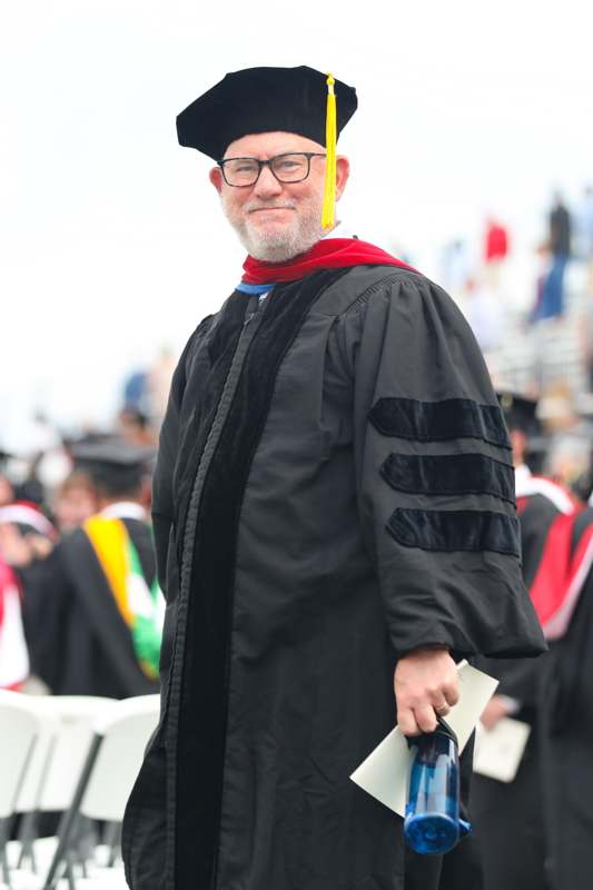 a man in a graduation gown
