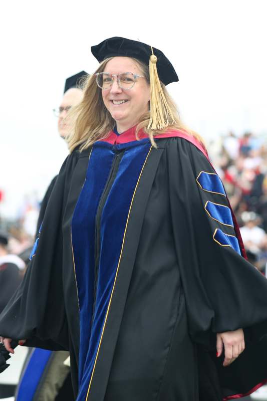 a woman wearing a graduation gown
