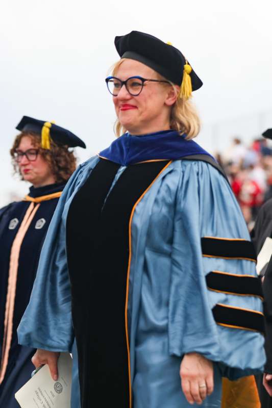 a woman in a graduation gown