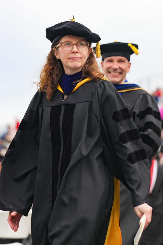 a woman in a graduation gown