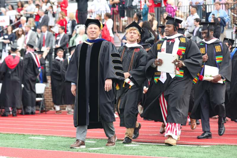 a group of people in graduation gowns