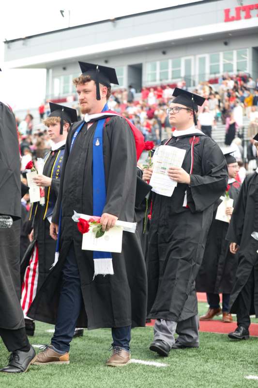 a group of people in graduation gowns