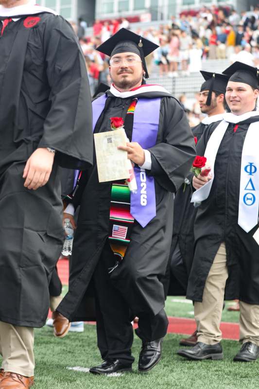 a man in a graduation gown