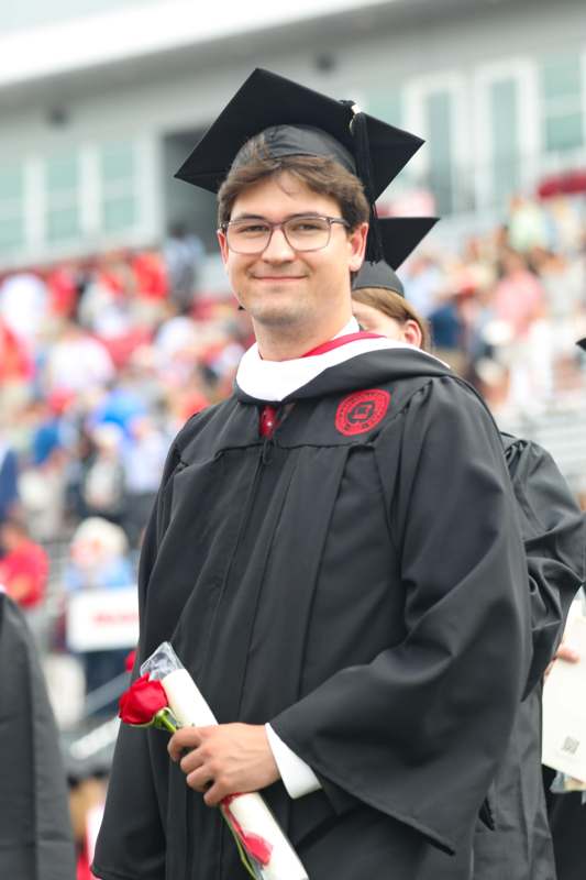 a man in a graduation gown