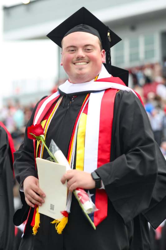 a man in a graduation gown
