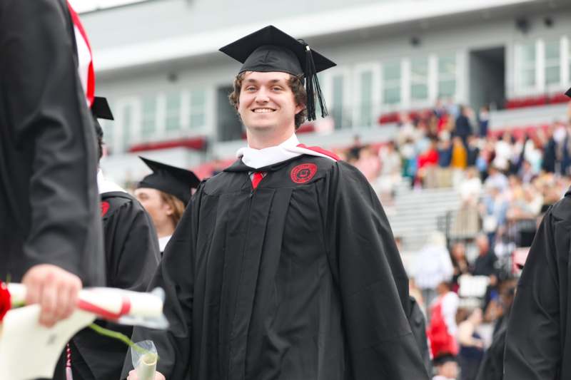 a man in a graduation gown