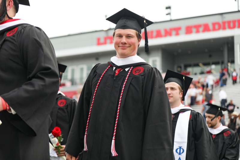 a man in a graduation gown
