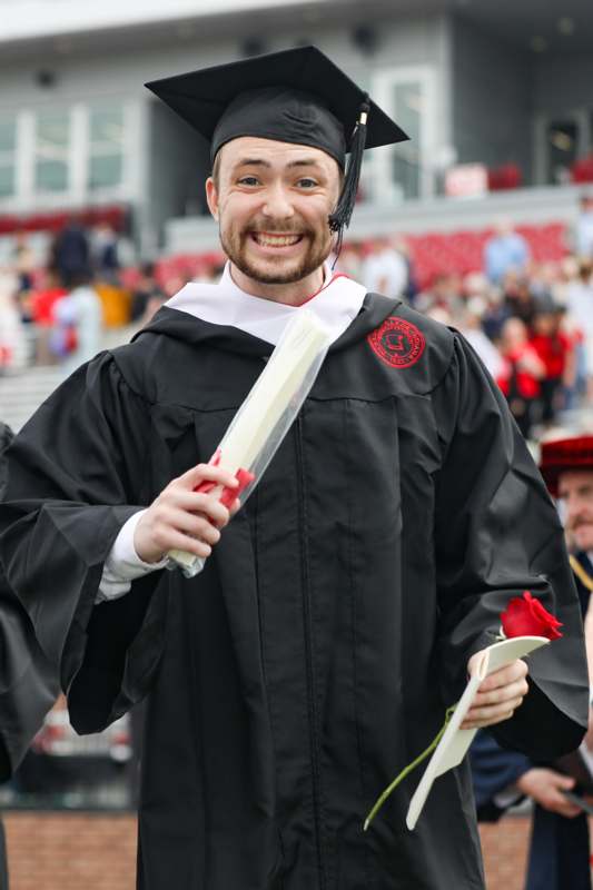 a man in a graduation gown