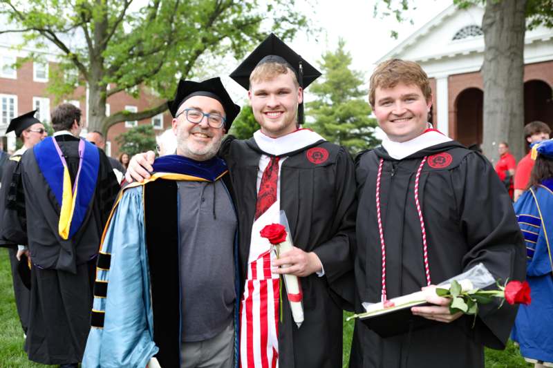 a group of men in graduation gowns