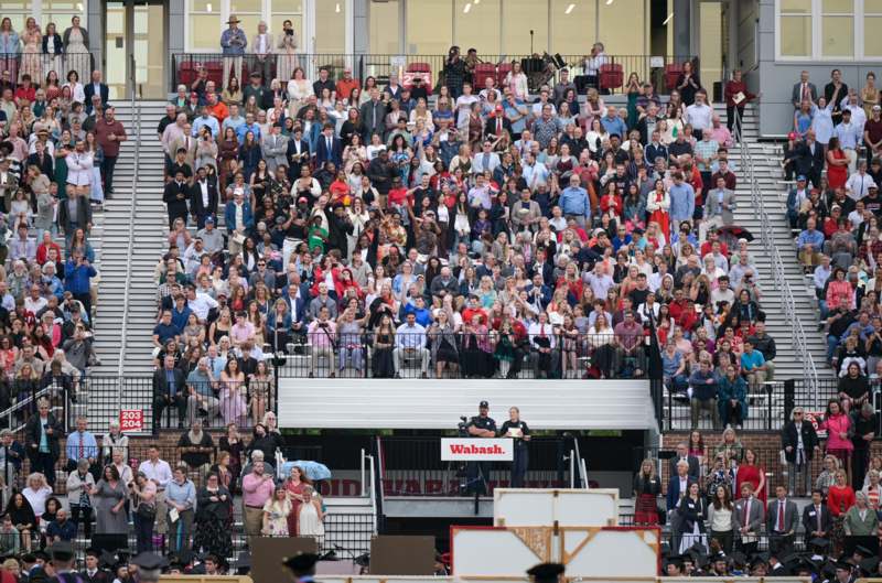 a large crowd of people in bleachers