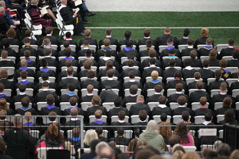 a group of people in graduation gowns