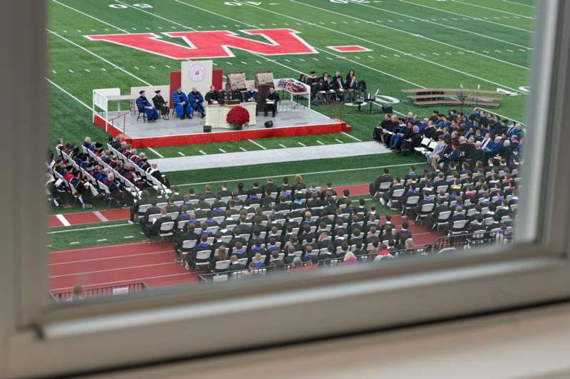 a graduation ceremony on a football field