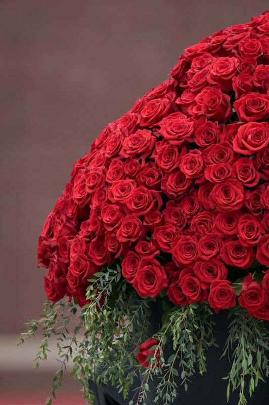 a large bouquet of red roses