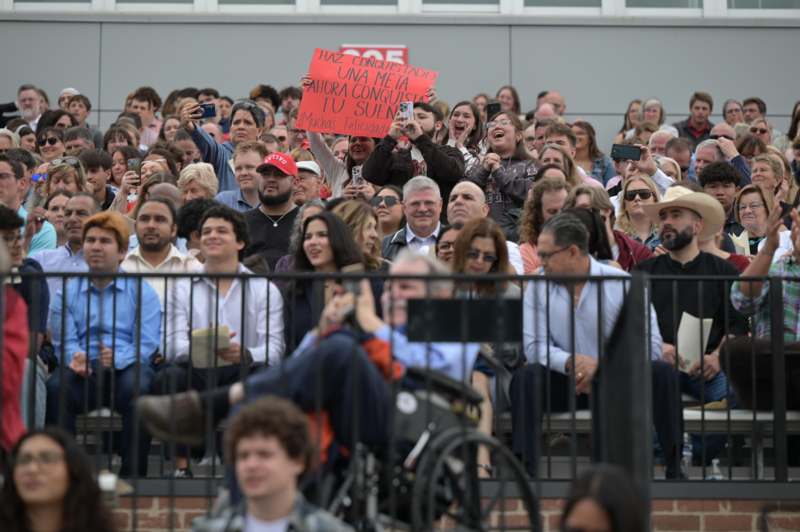 a crowd of people sitting on stairs