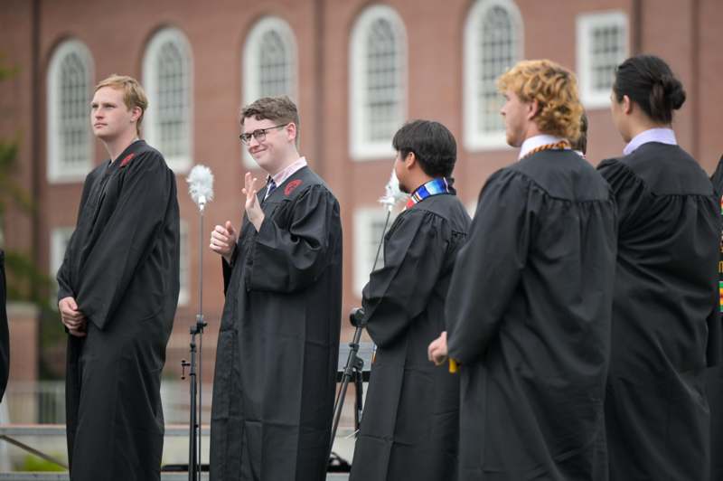 a group of men in black robes standing in a line