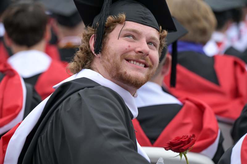 a man in a graduation gown