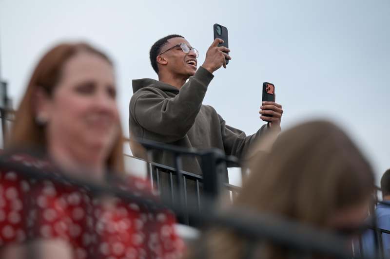 a man taking a selfie with a group of people