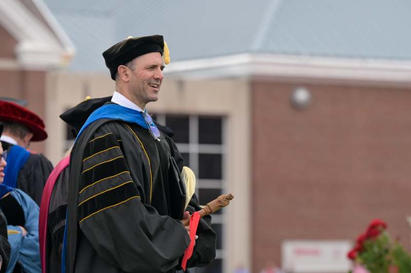 a man in a graduation gown