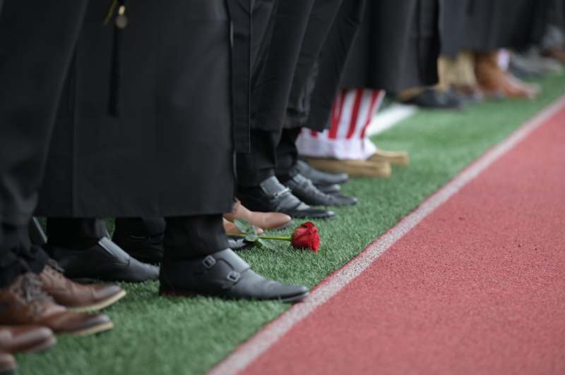 a group of people standing on a football field