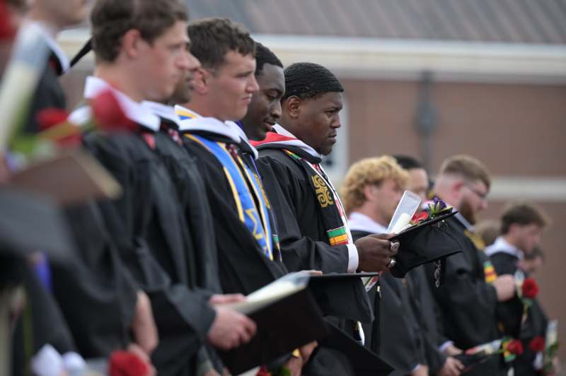 a group of people in graduation gowns