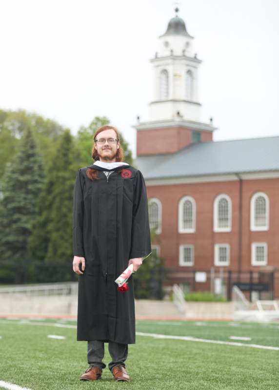 a man in a graduation gown