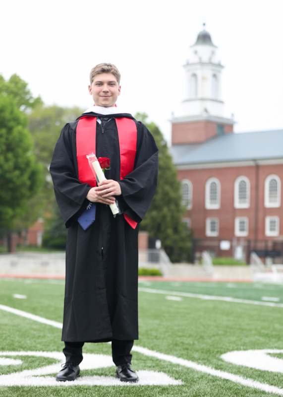 a man in a graduation gown