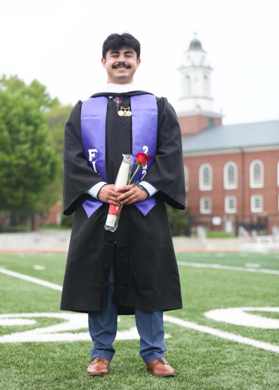 a man in a graduation gown