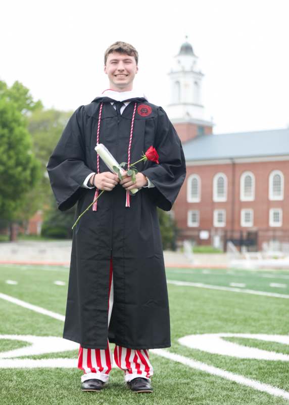 a man in a graduation gown