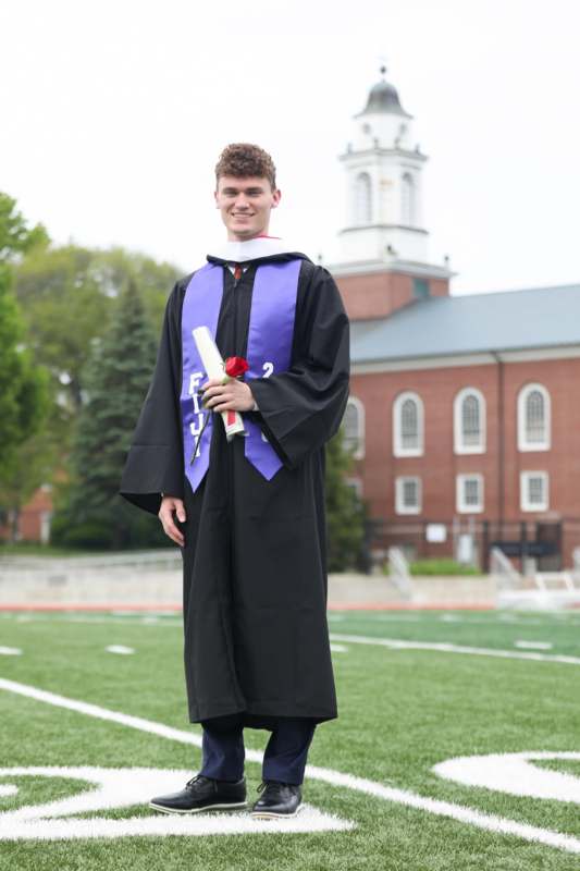 a man in a graduation gown