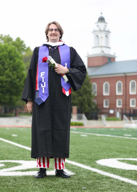 a man in a graduation gown