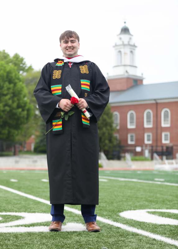 a man in a graduation gown