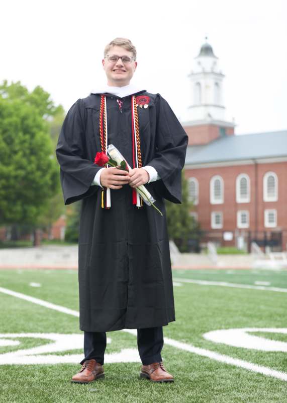 a man in a graduation gown